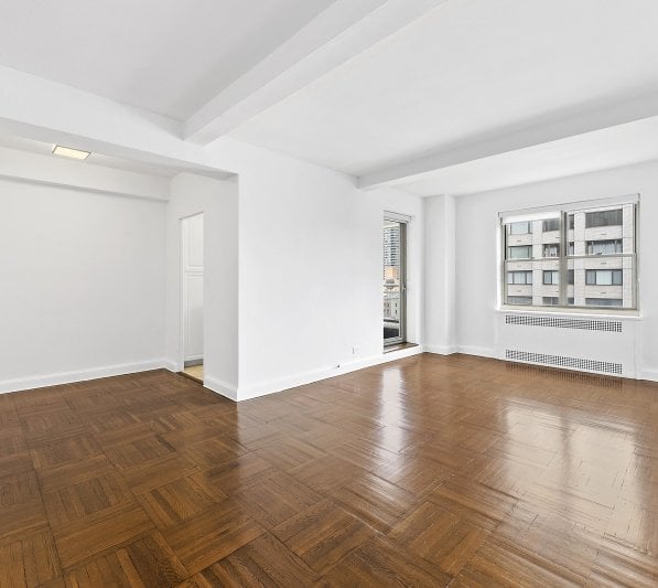 an empty living room in a high end NYC apartment rental