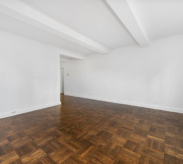 an empty living room in a high end NYC apartment rental