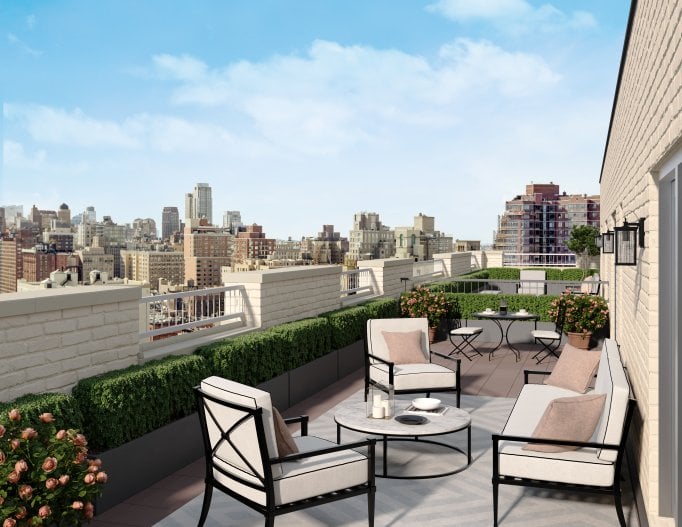 Terrace in an apartment building overlooking New York City on a sunny day