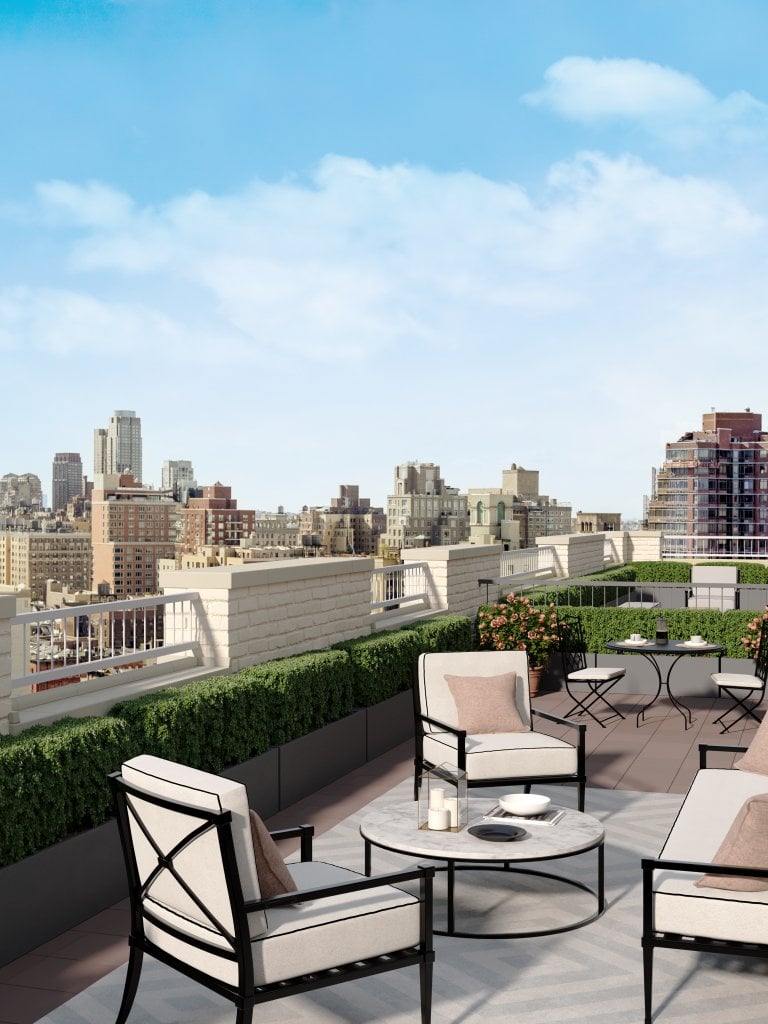 Terrace in an apartment building overlooking New York City on a sunny day