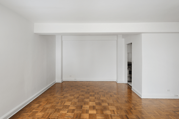 an empty living room in an NYC apartment rental