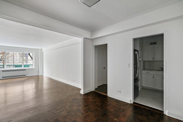 - foyer living room kitchen upper east side renovated central park walnut floors