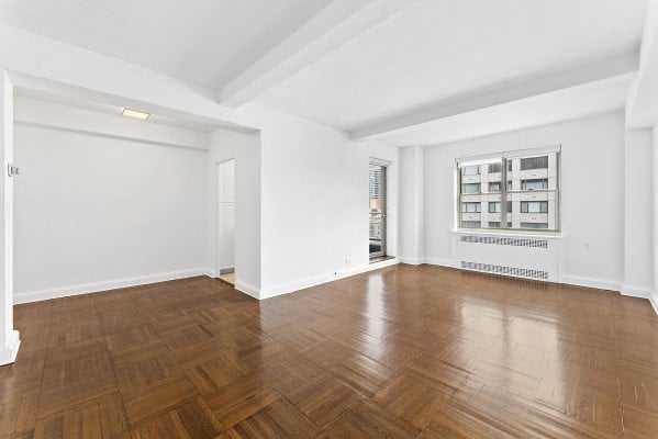 an empty living room in a high end NYC apartment rental