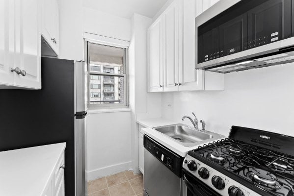 A kitchen with a gas range in a NYC apartment rental