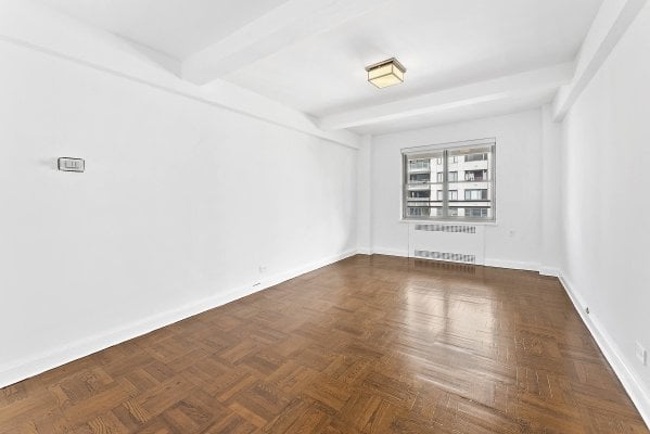 an empty bedroom in an NYC apartment rental