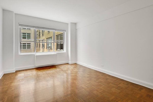 an empty white room in an NYC apartment rental