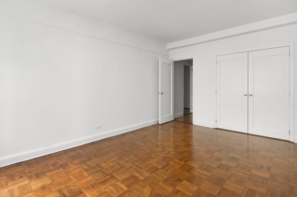 an empty living room in an NYC apartment rental