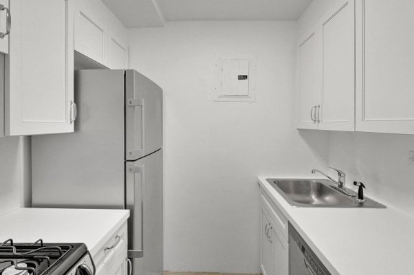 a clean white kitchen in an NYC apartment rental